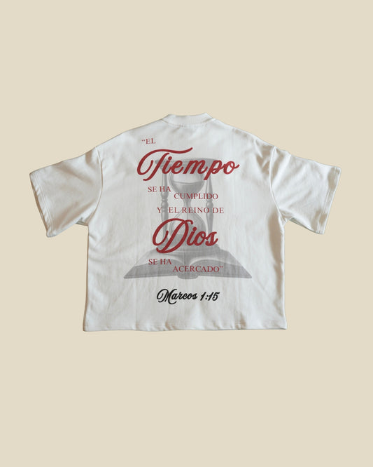 KAIROS JESUS HABLÓ bone tee back with Mark 1:15 artwork shown from the back, featuring a red and black graphic print with brand logo, verse and displayed on a solid beige background.